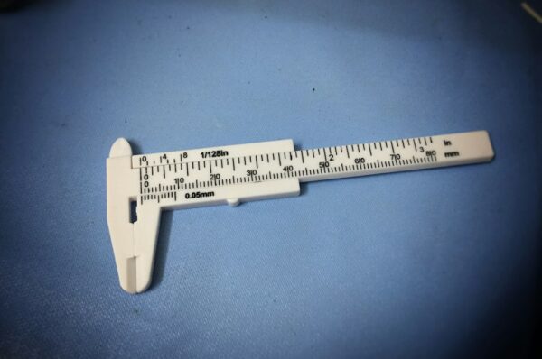 Vernier caliper measuring an object for reverse engineering and 3D printing